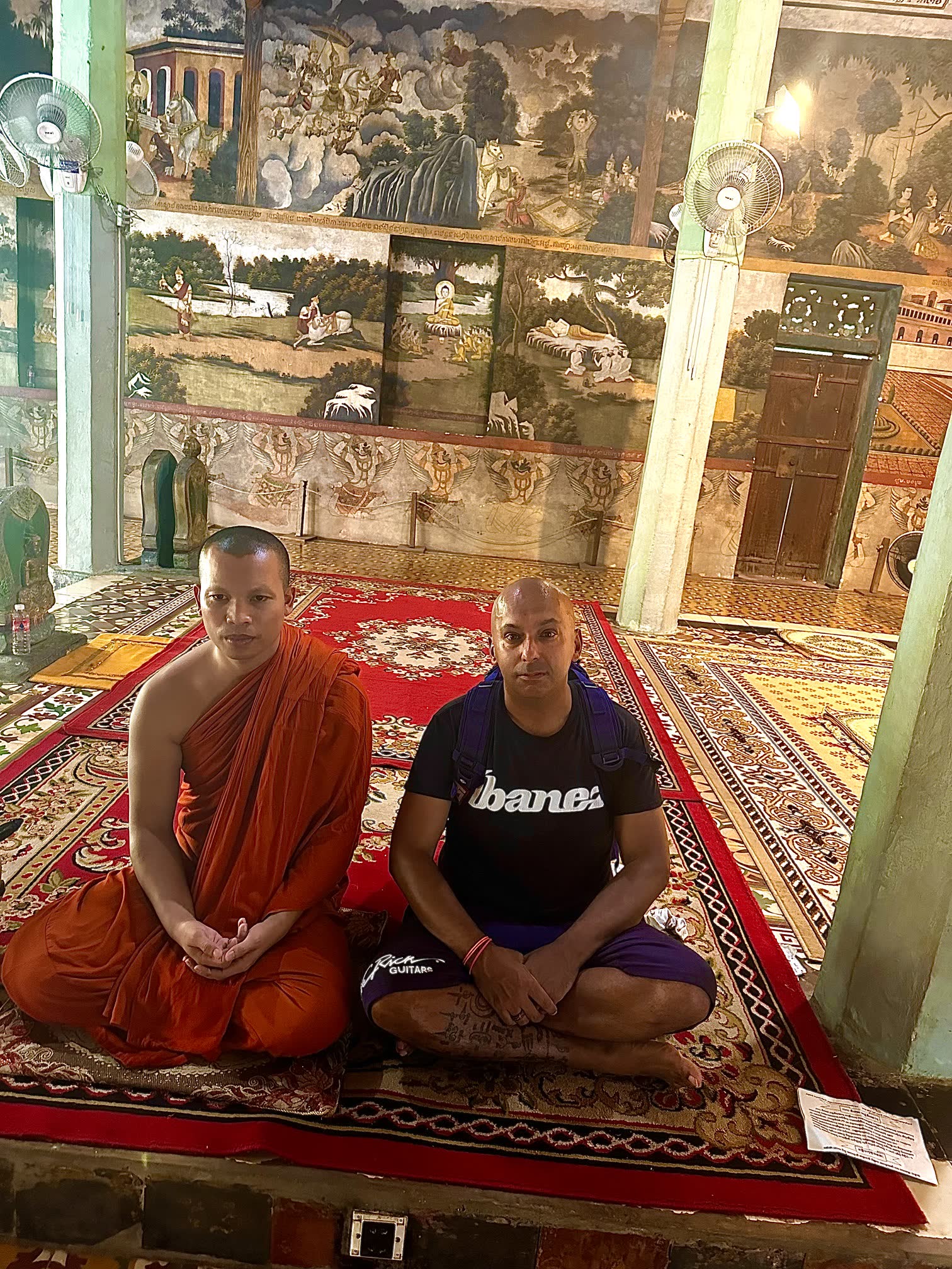 David Chung in meditation with a monk in a temple