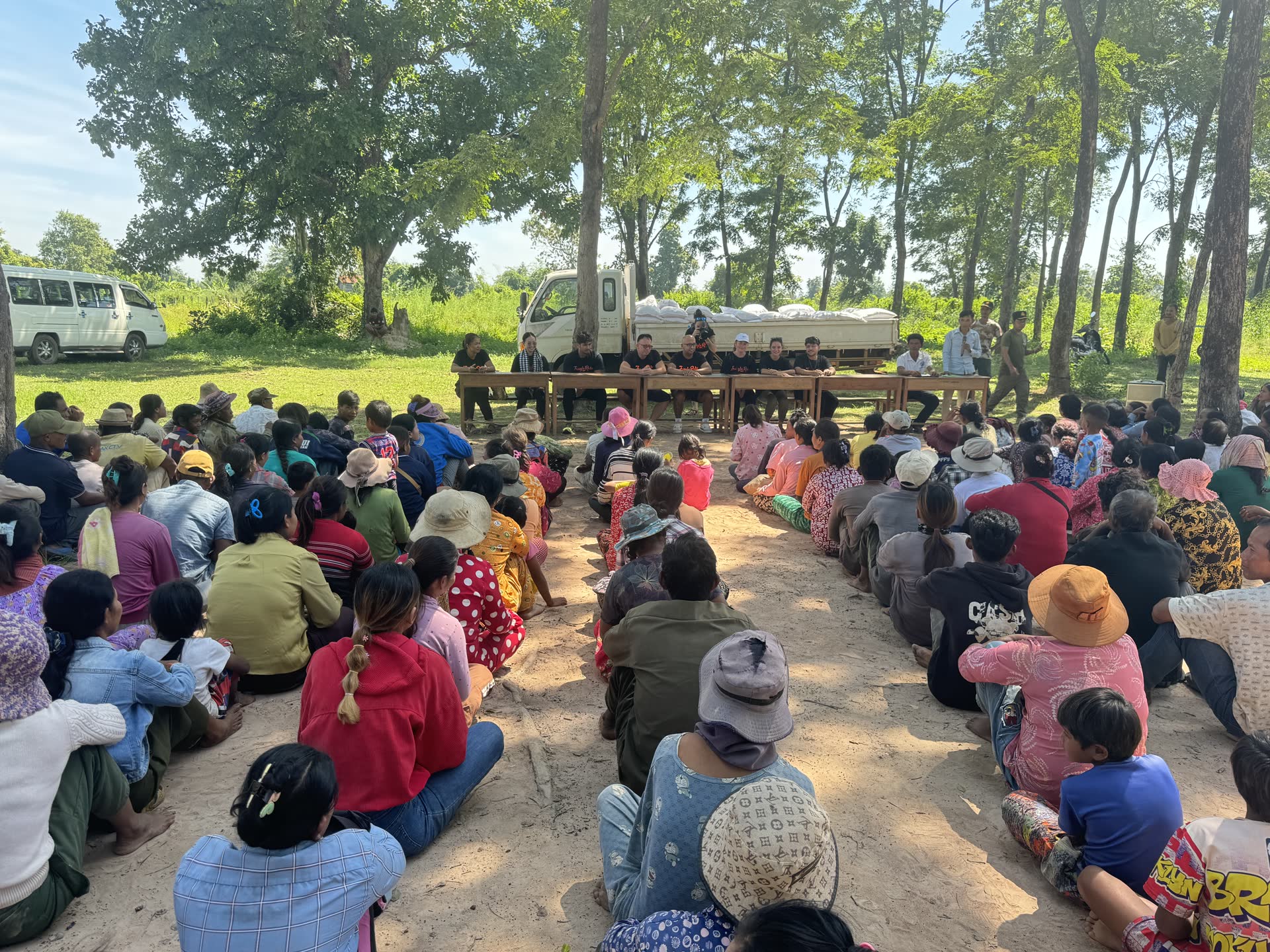 David Chung handing out locally bought items to families in the interior of Cambodia