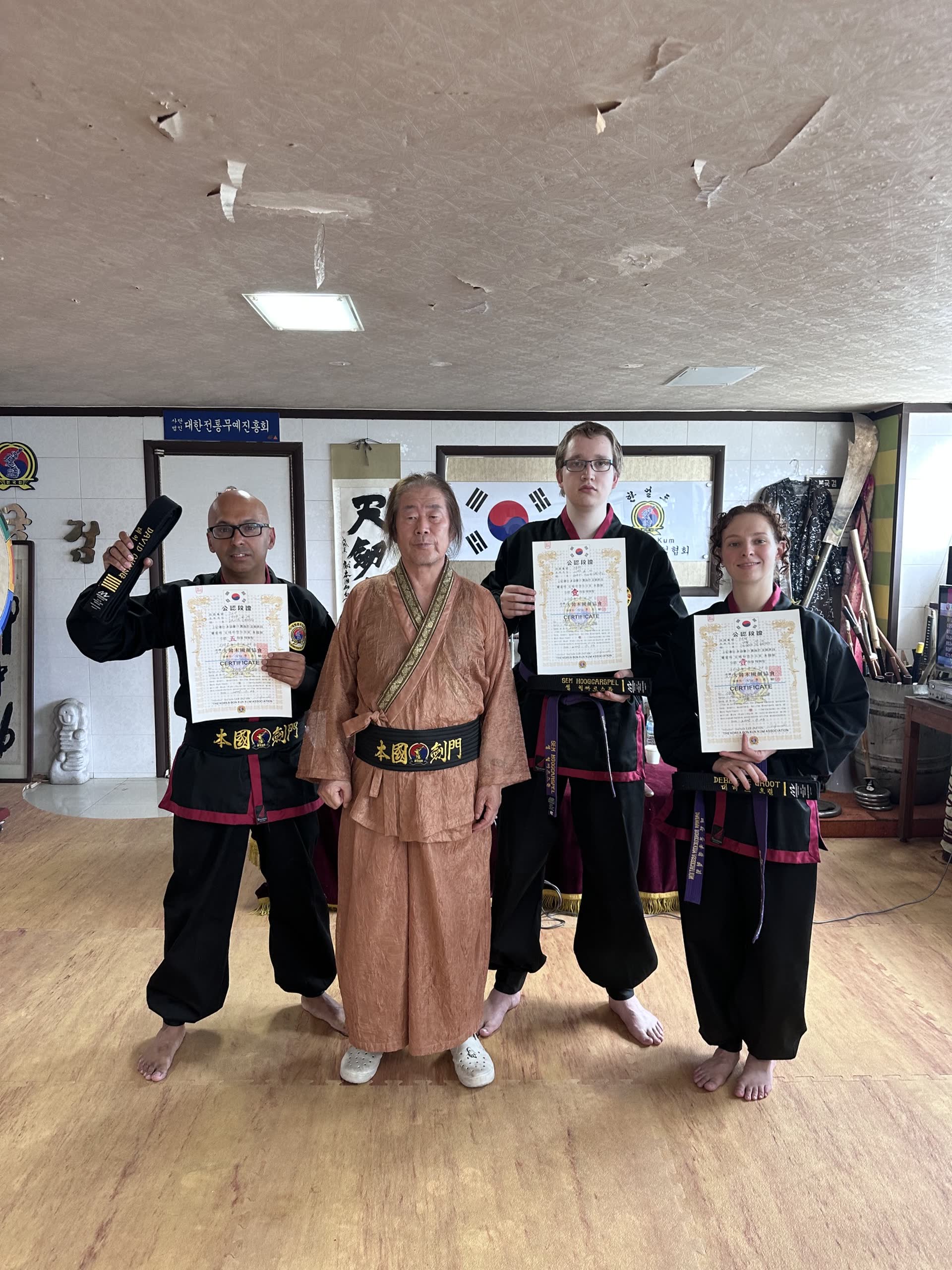 David Chung with students and the grandmaster after an examination in South Korea